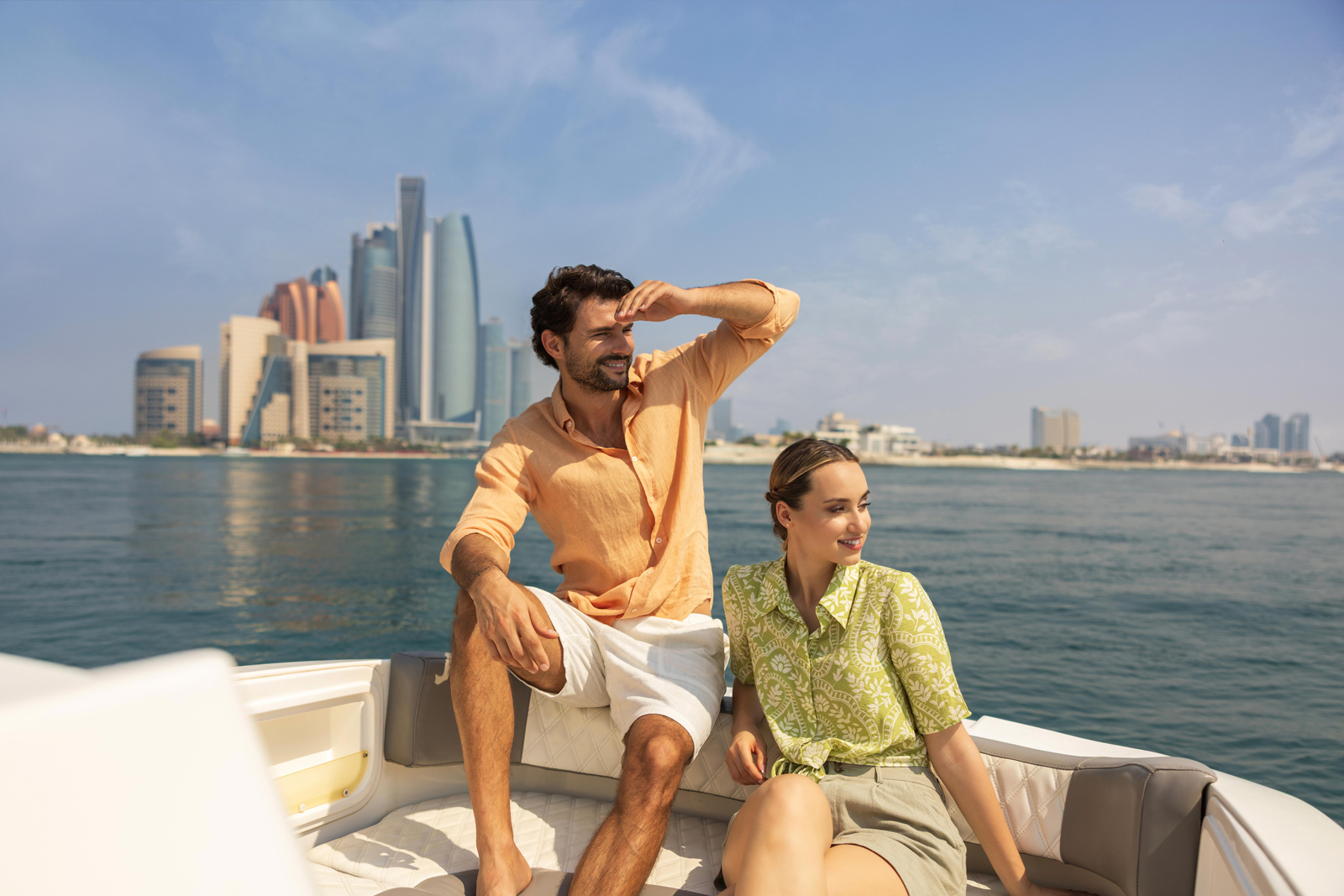 man and woman on a boat in Abu Dhabi maritime waterscape