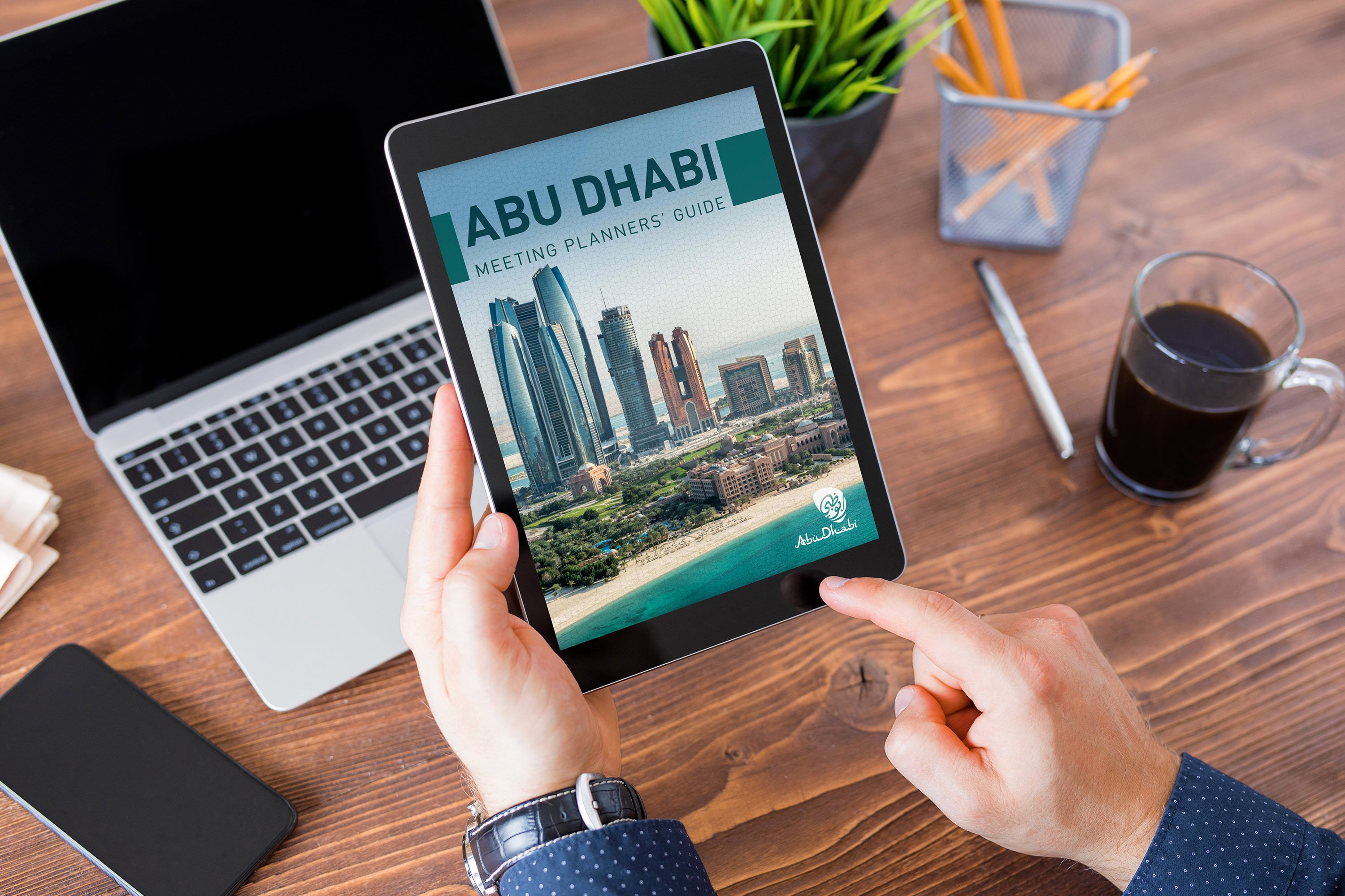 Abu Dhabi Meeting Planners' Guide displayed on a tablet