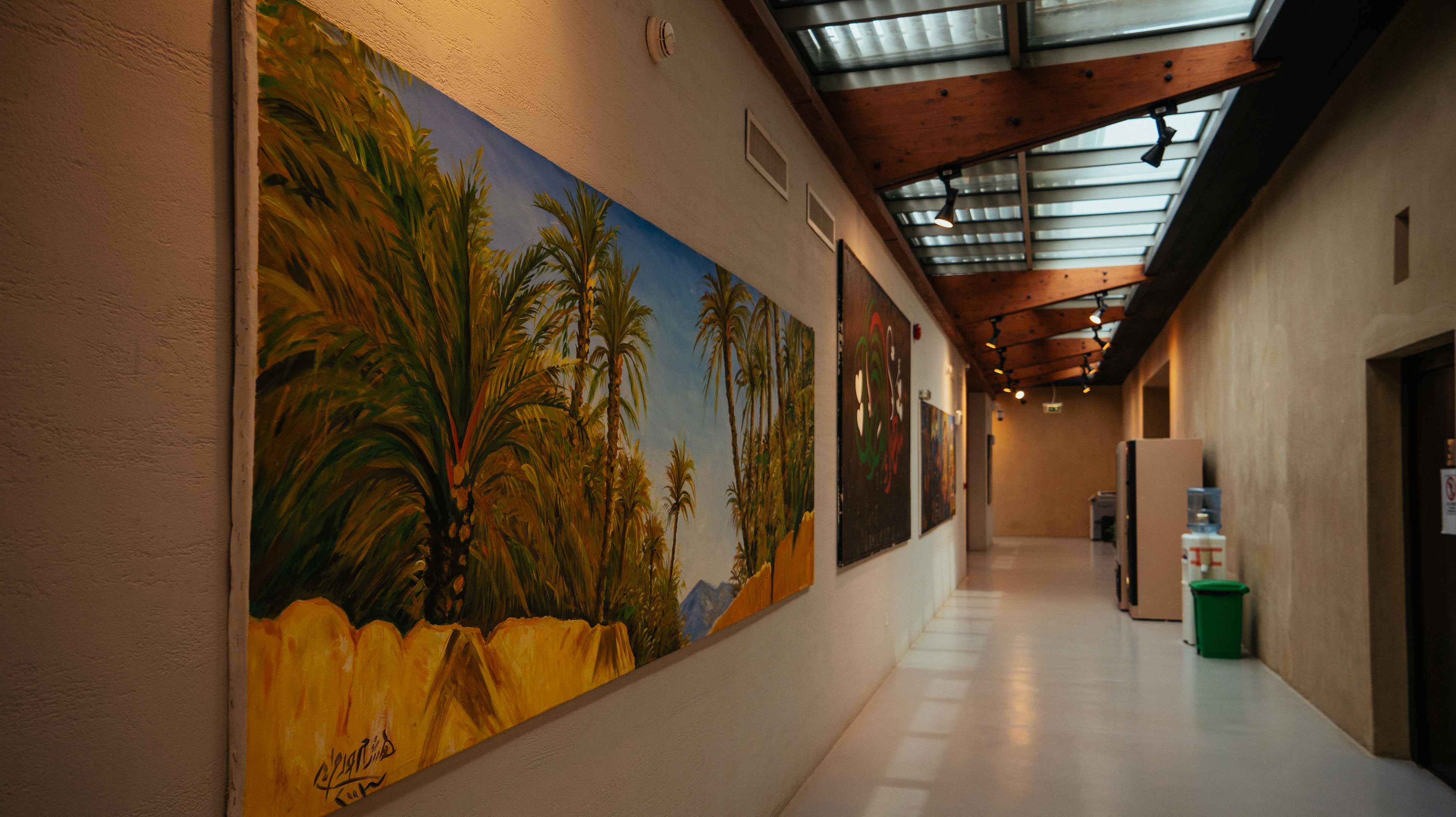 A painting of palm trees at Al Qattara Arts Centre