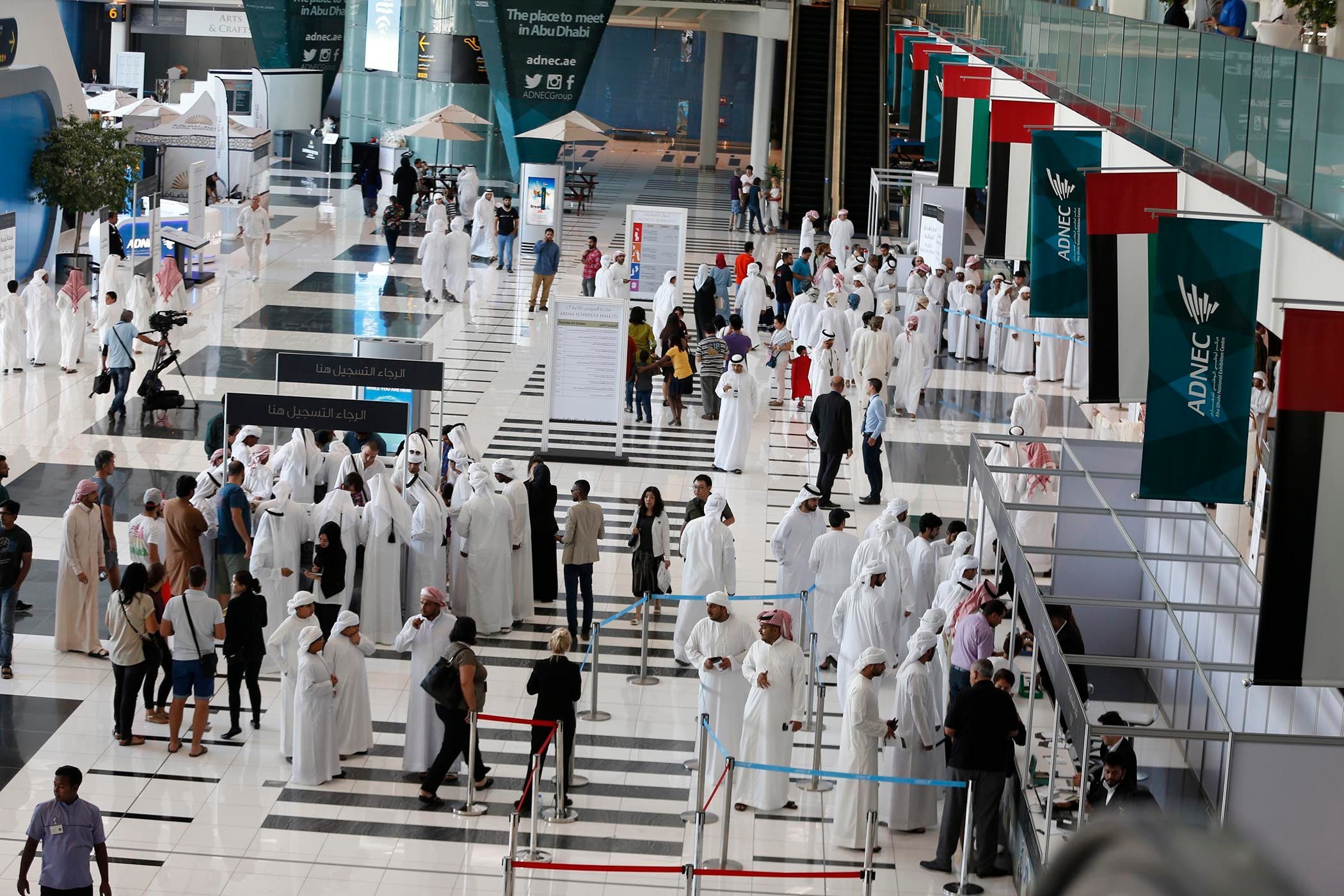 Bird's eye view of attendees at a conference centre hosting a business event in Abu Dhabi