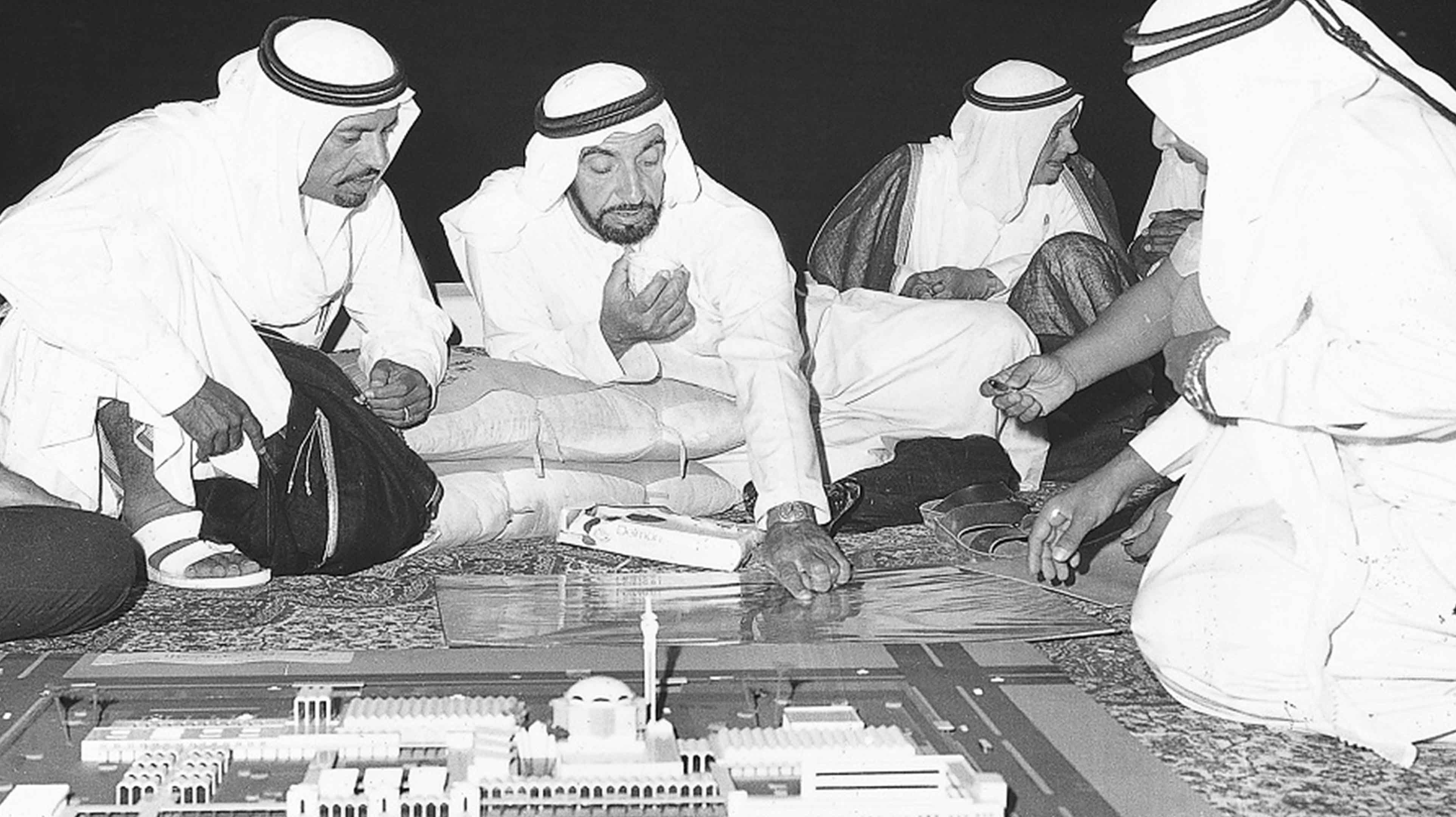 Sheikh Zayed poring over architectural plans of the Cultural Foundation