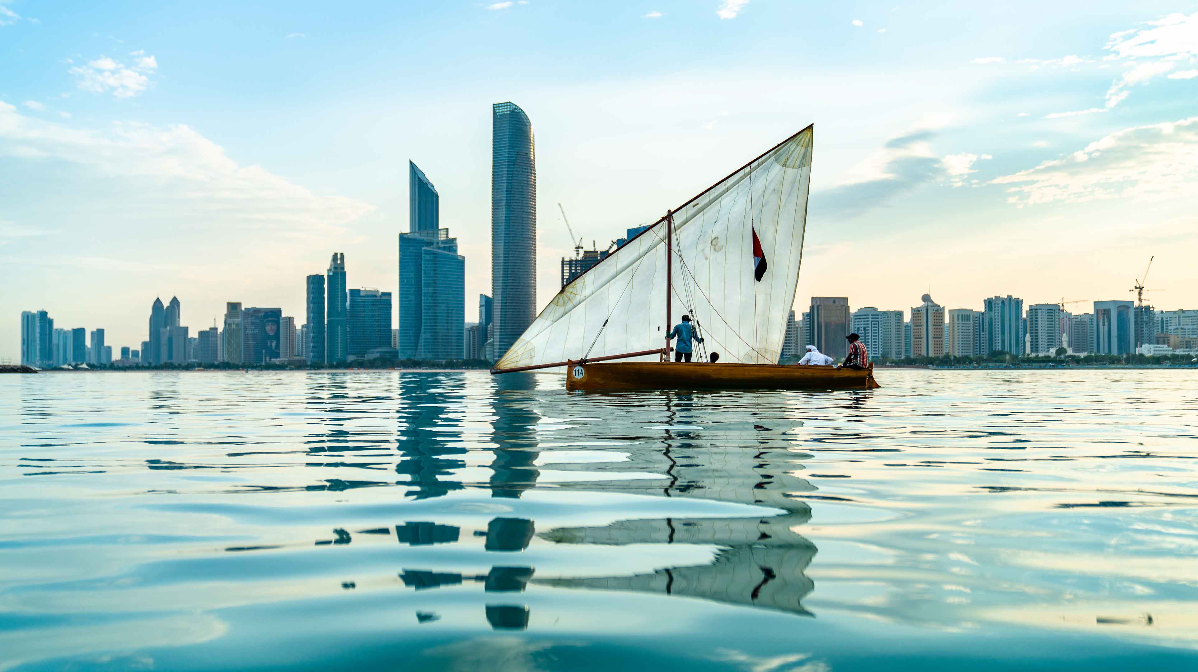 Traditional Emirati sailing boat on the waters traveling towards Abu Dhabi
