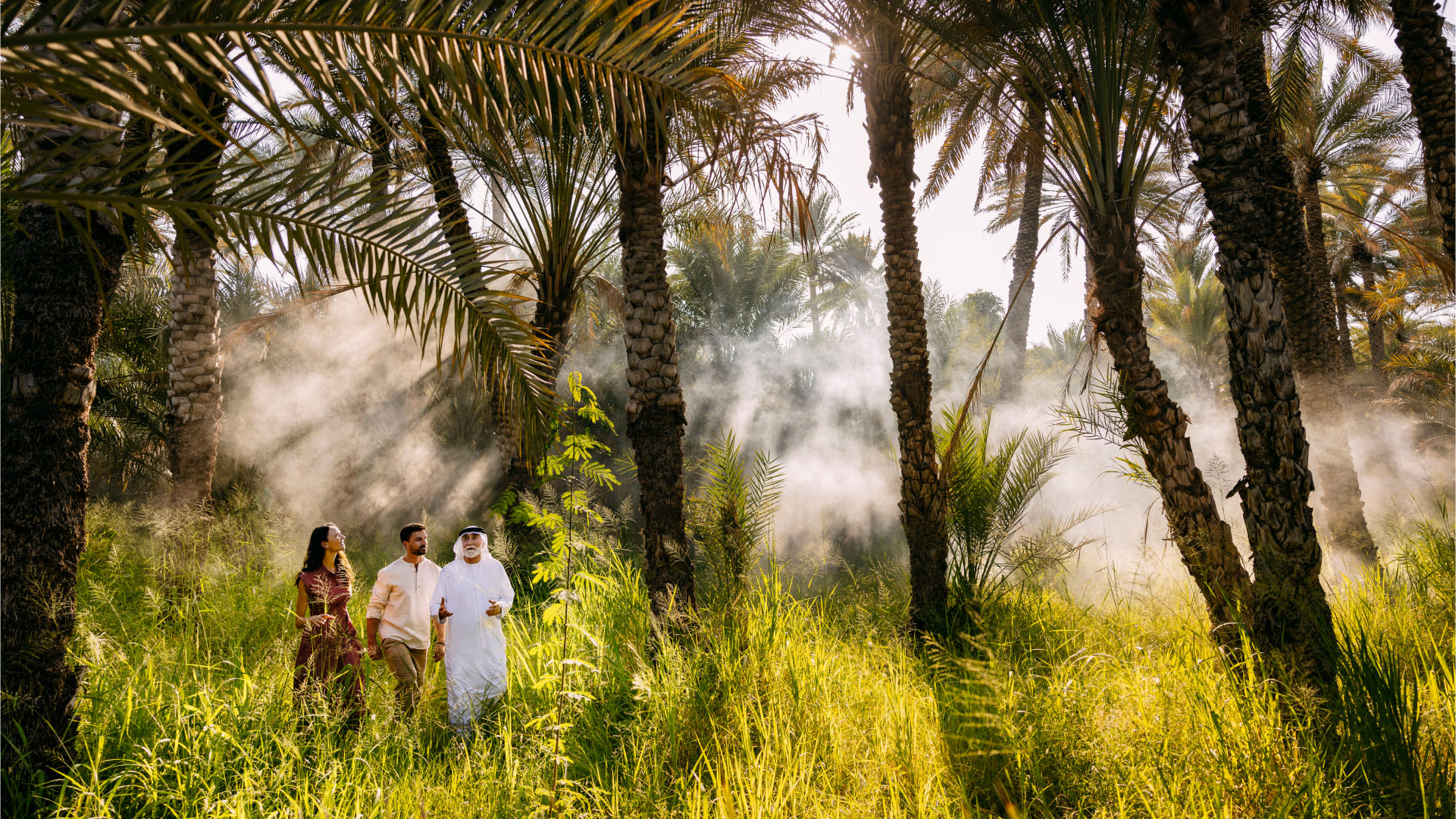 A couple on a visit to one of Abu Dhabi's green Al Ain oases with an Emirati guide