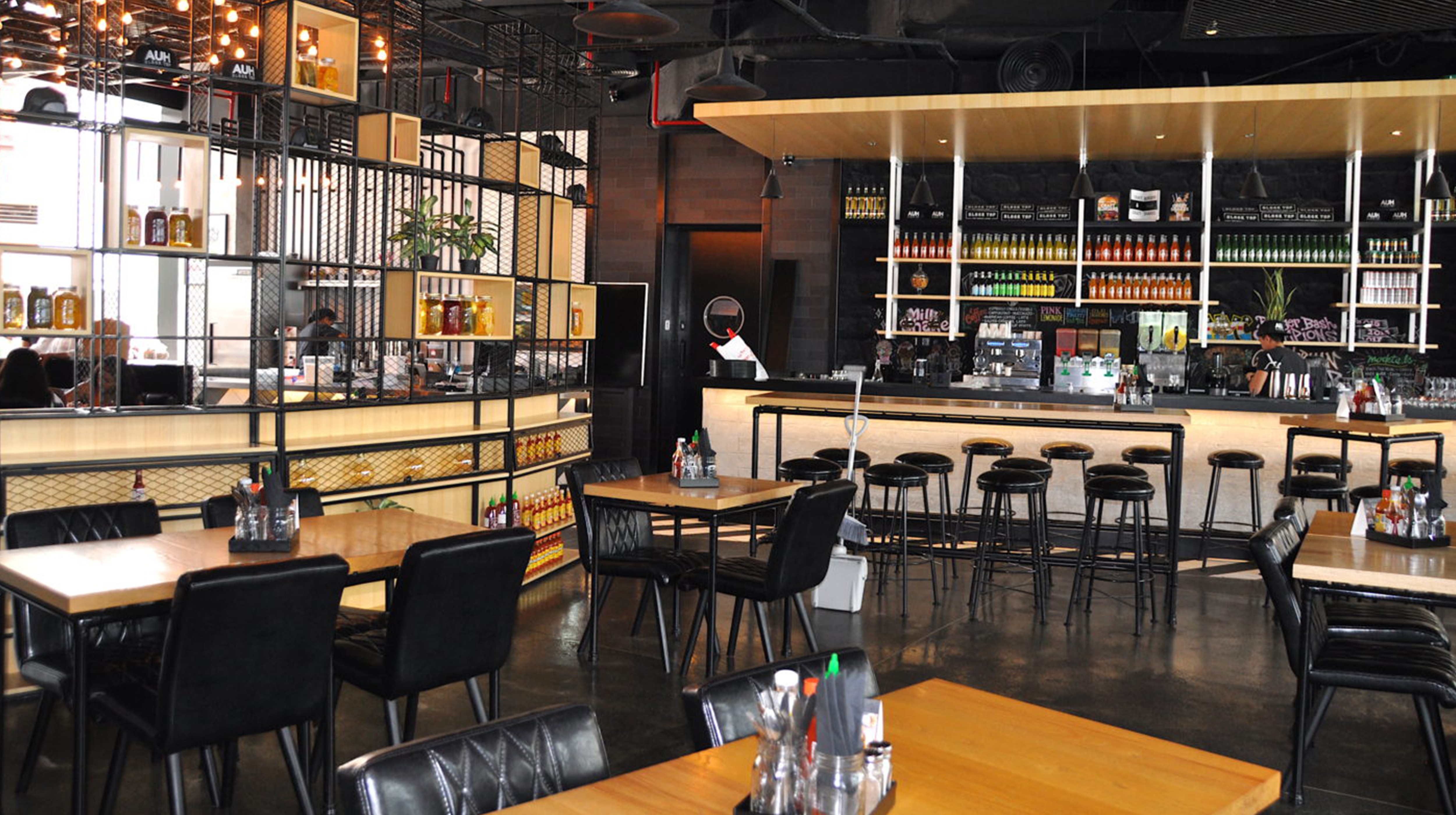 Dining tables and bar at Black Tap