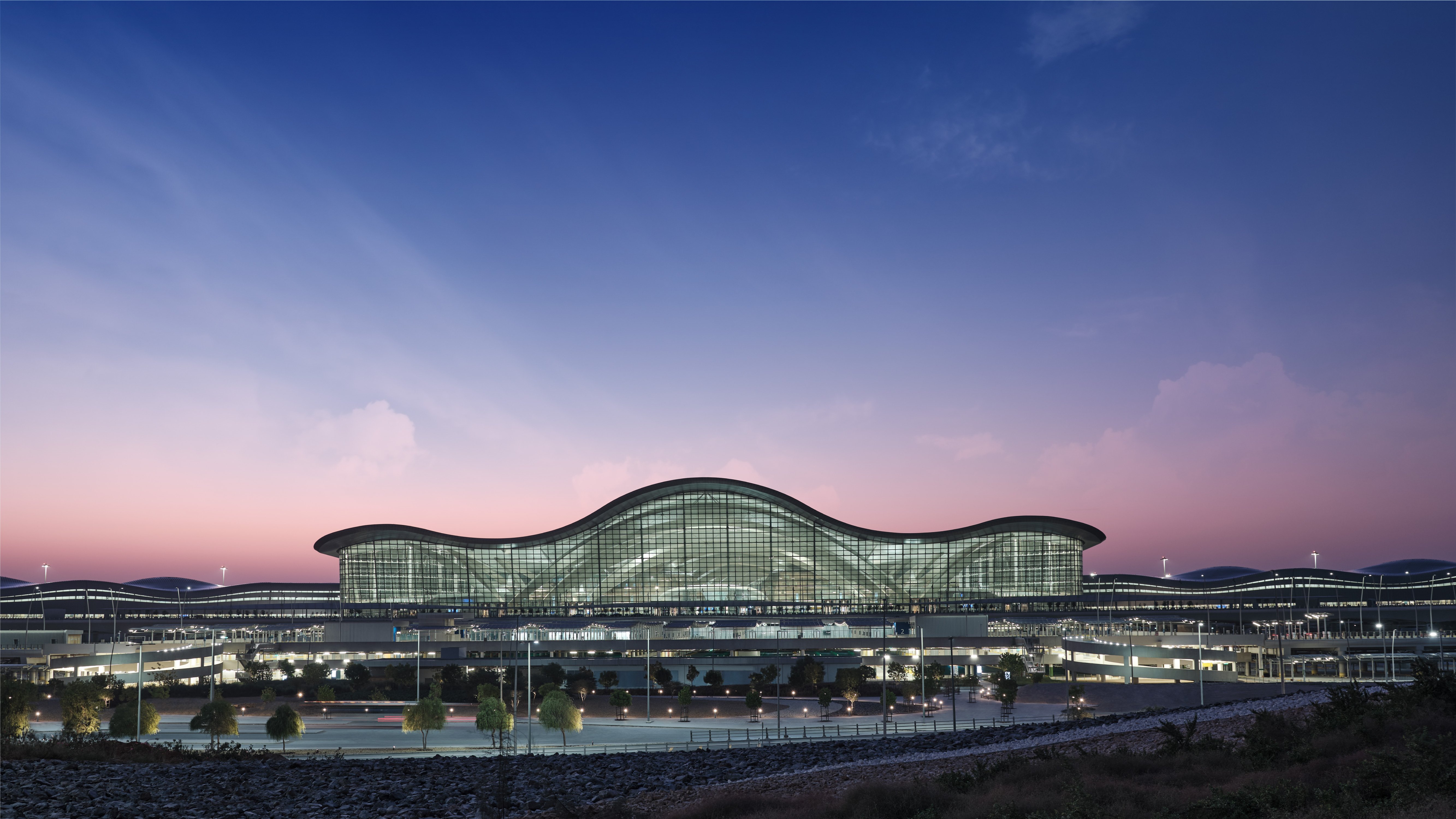 Stunning view of the Zayed Airport Terminal A in Abu Dhabi during twilight.