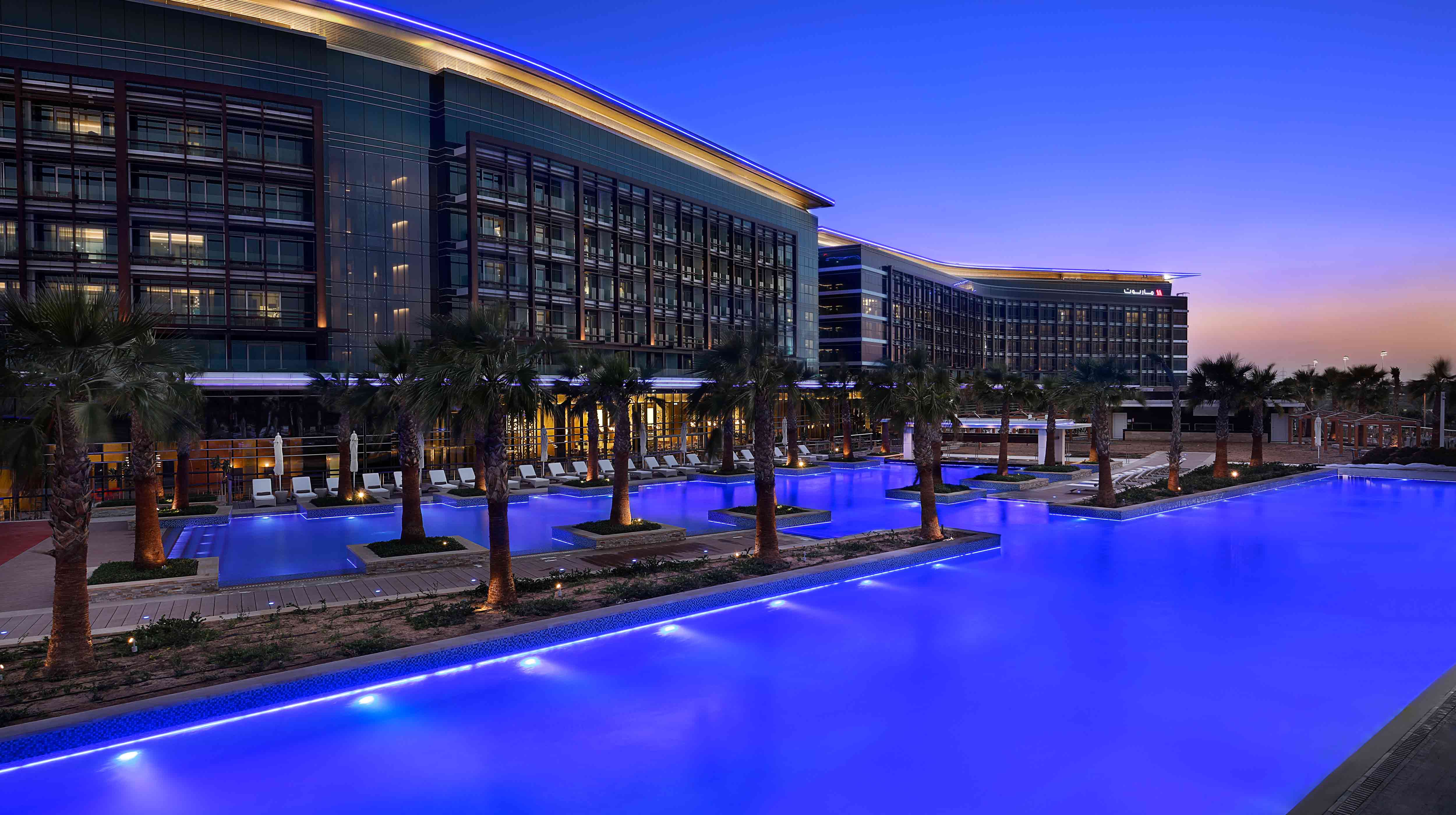 Exterior of Marriott Hotel Al Forsan lit up at night