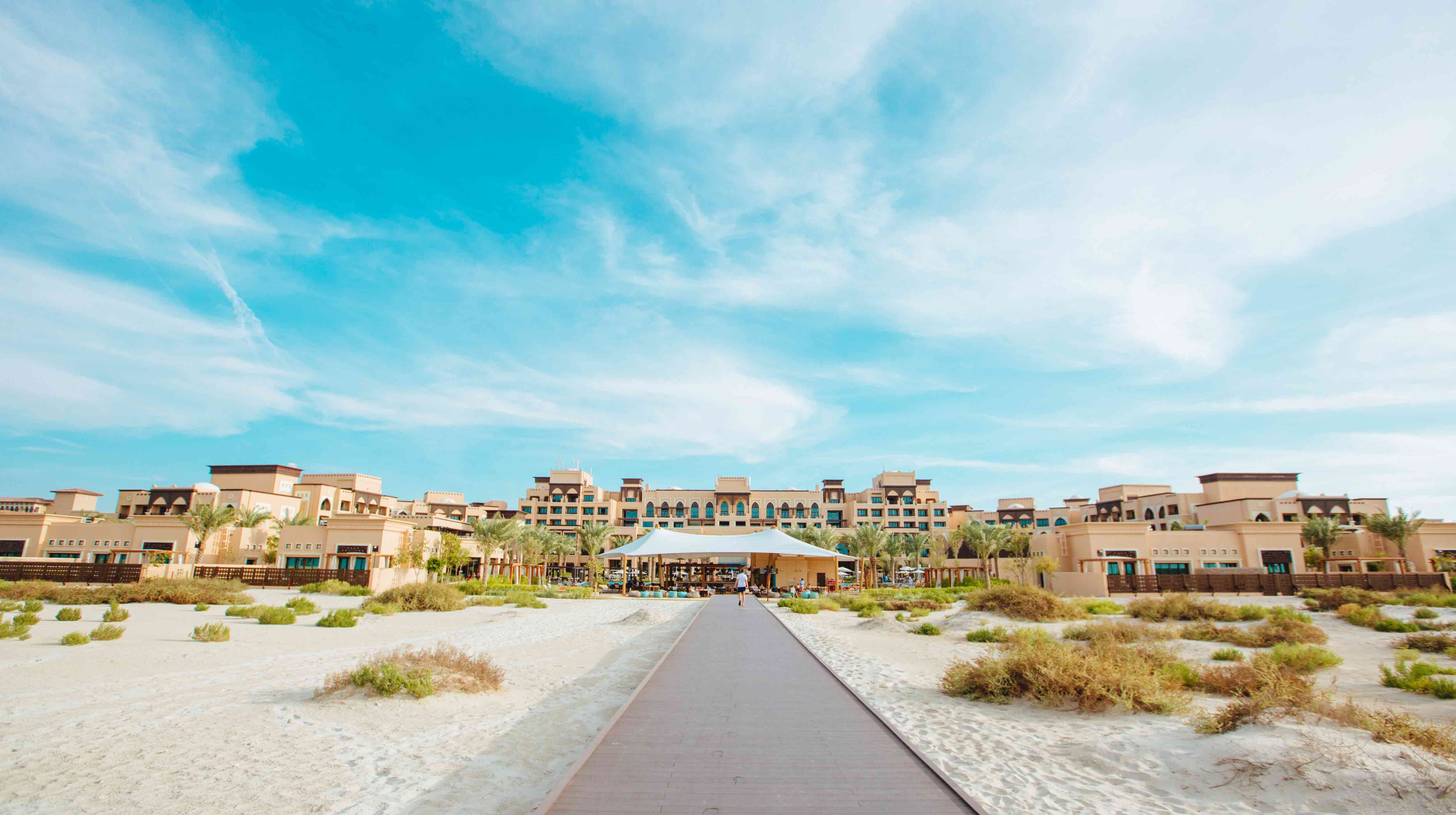 Exterior of Saadiyat Rotana Resort & Villas from the path to the beach