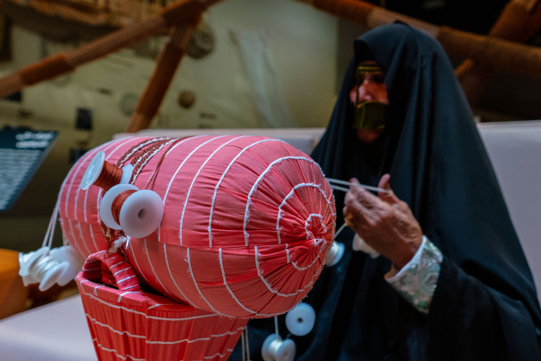Emirati woman's hand weaving traditional Bedouin Sadu