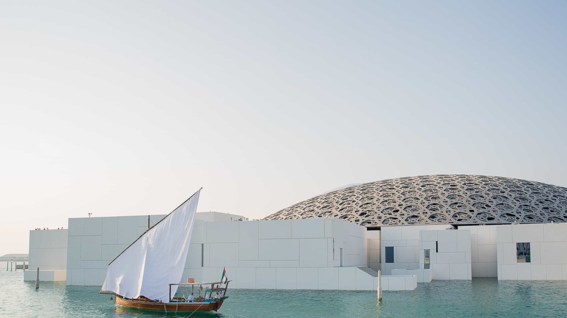 The Louvre Abu Dhabi floats off the shores of the city's Saadiyat Island, the city's cultural district. Image credit: Department of Culture and Tourism - Abu Dhabi