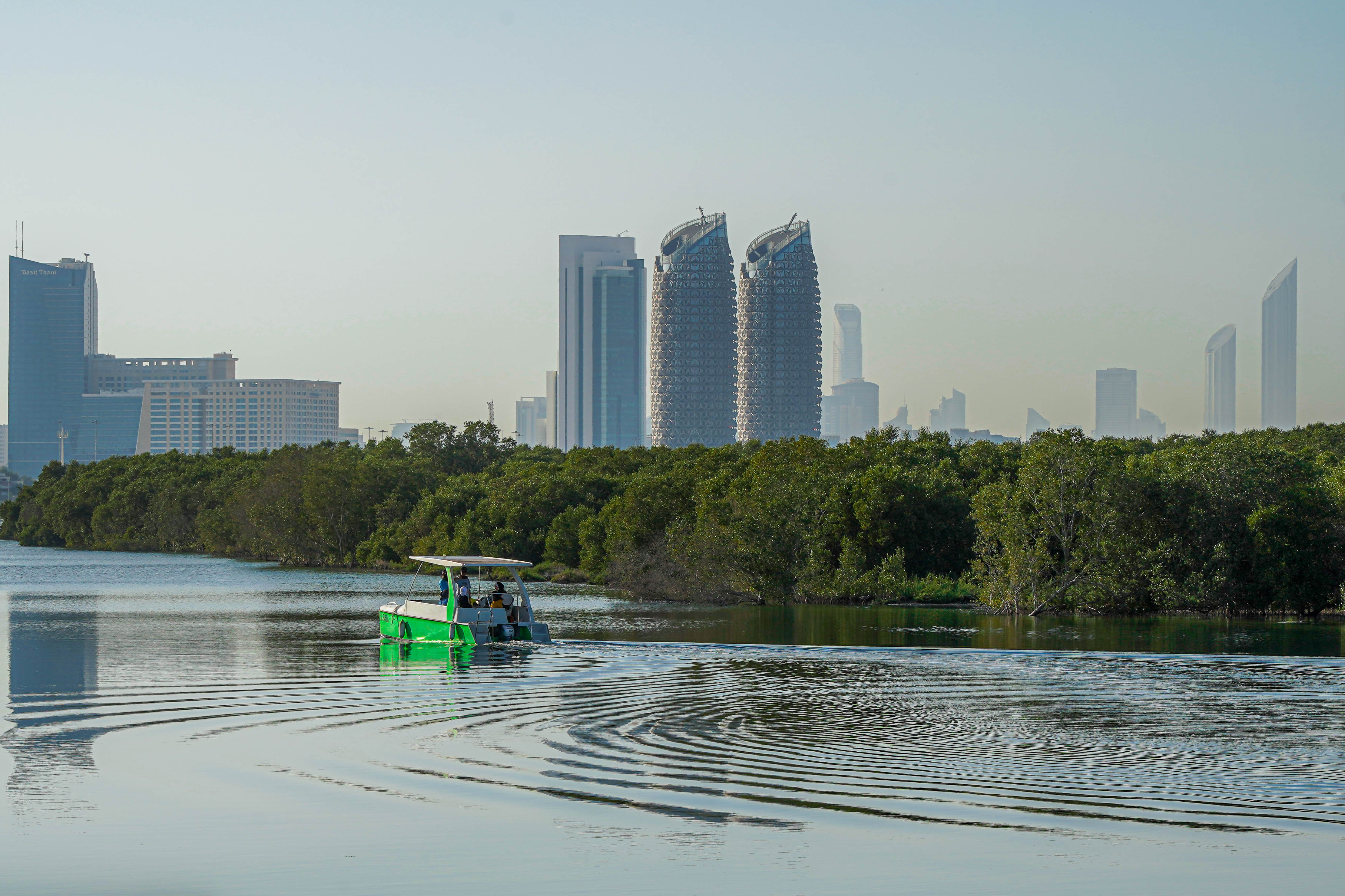 View of the Abu Dhabi skyline and mangroves from the water at Al Gurm Corniche