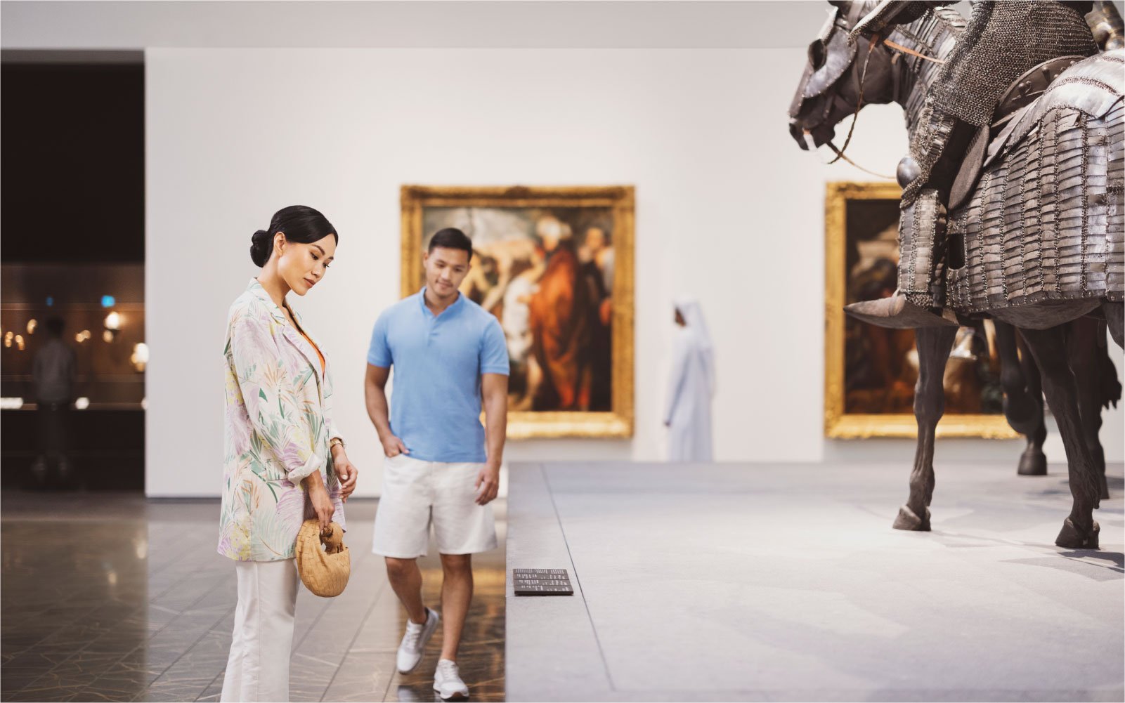 Couple exploring historic artifacts and exhibits on Saadiyat Island in Abu Dhabi.
