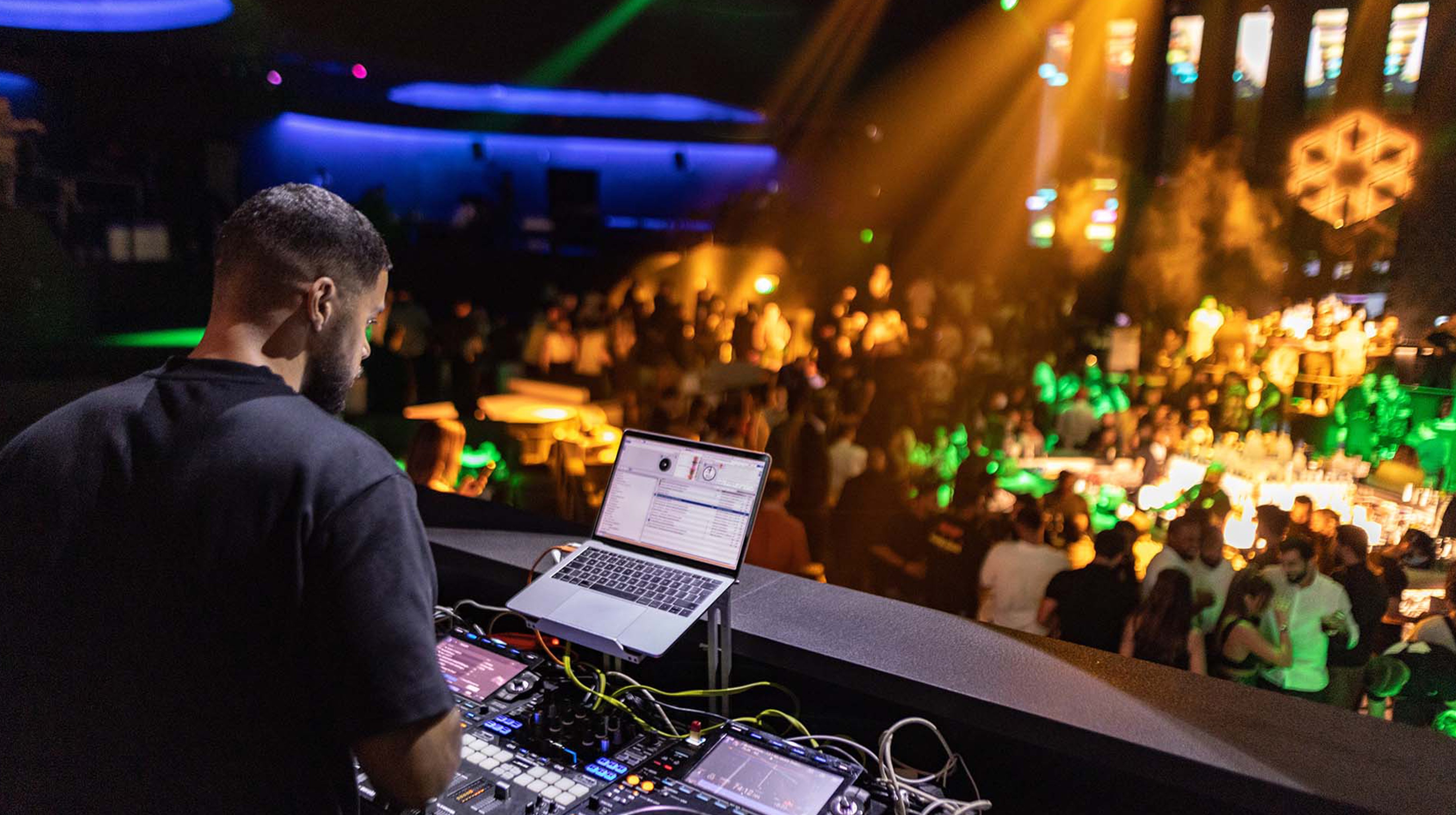 A DJ playing music at the White Abu Dhabi